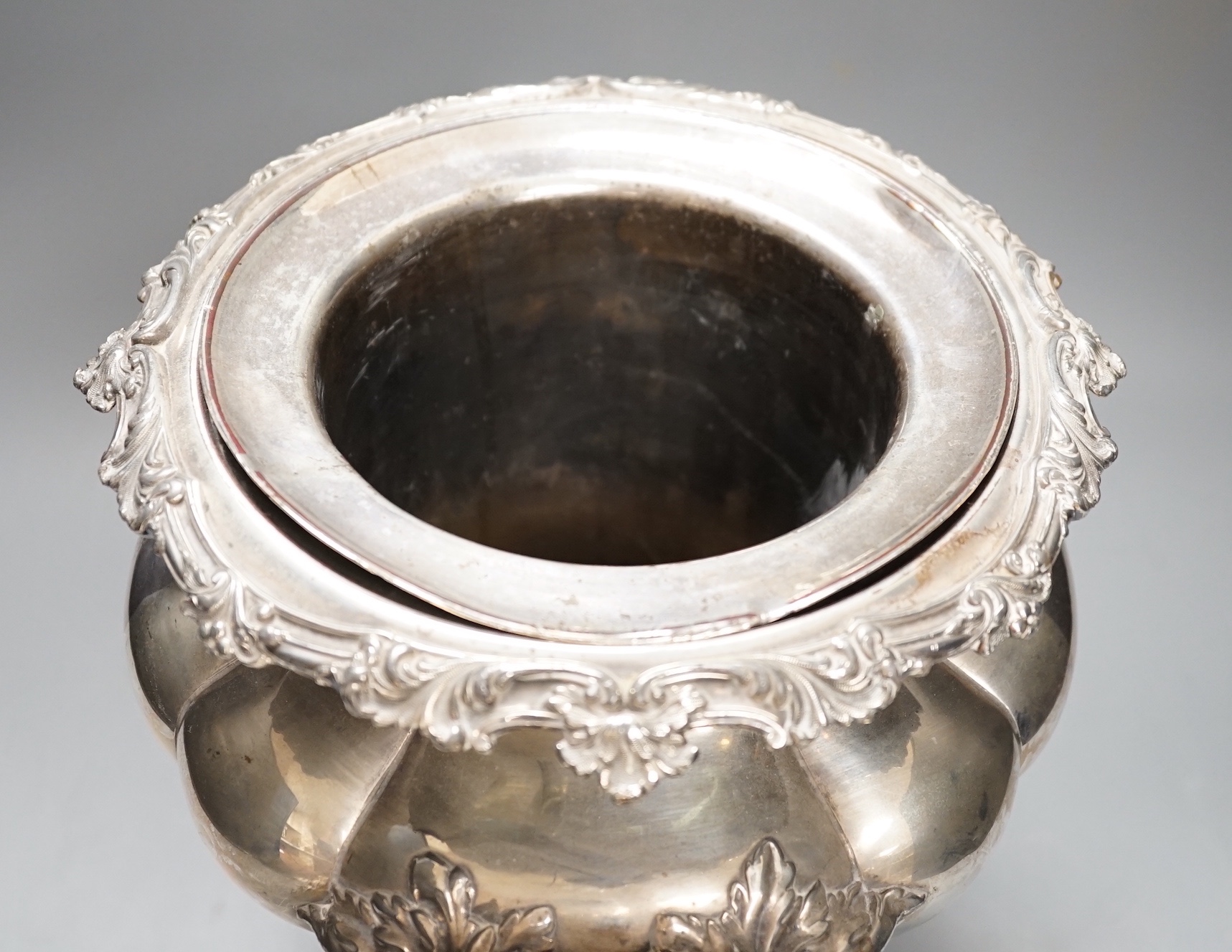 A William IV Old Sheffield plate twin handled wine cooler, with liner, acanthus scrolled borders, on four scrolled feet Height 28cm